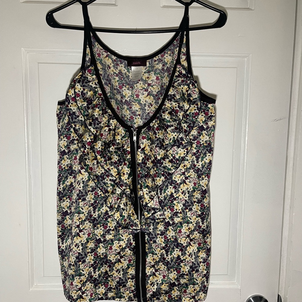 This cute flower printed shirt is sure to brighten your day!